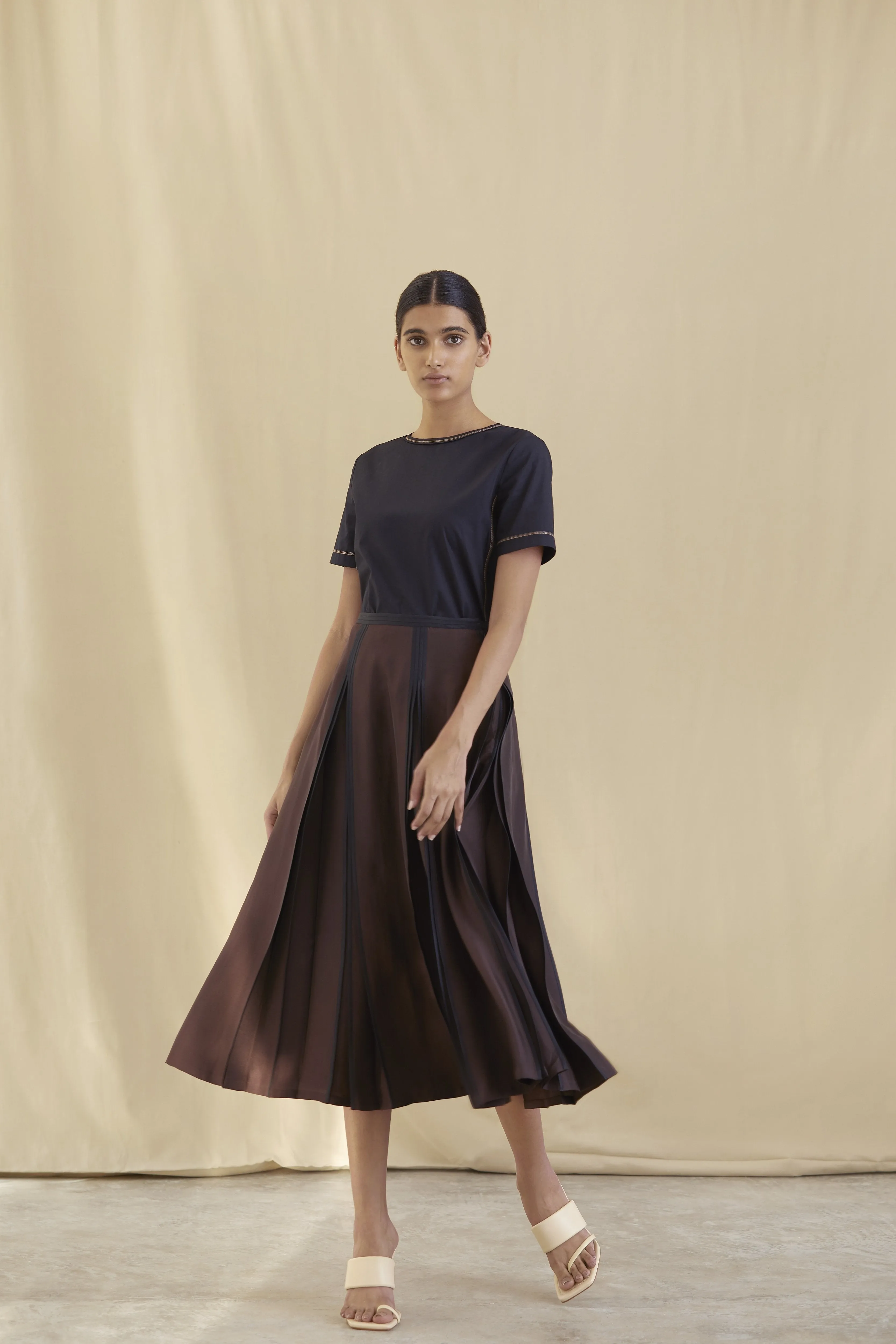 Silk skirt with partially opened pleating